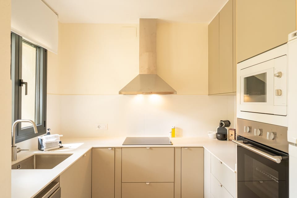 The main kitchen at Majordoms Velo is fully equipped for a group of 10: oven, toaster, blender, juicer, paella pans, pots, full cutlery and crockery. Self-catering made easy for cycling groups or family holidays.
