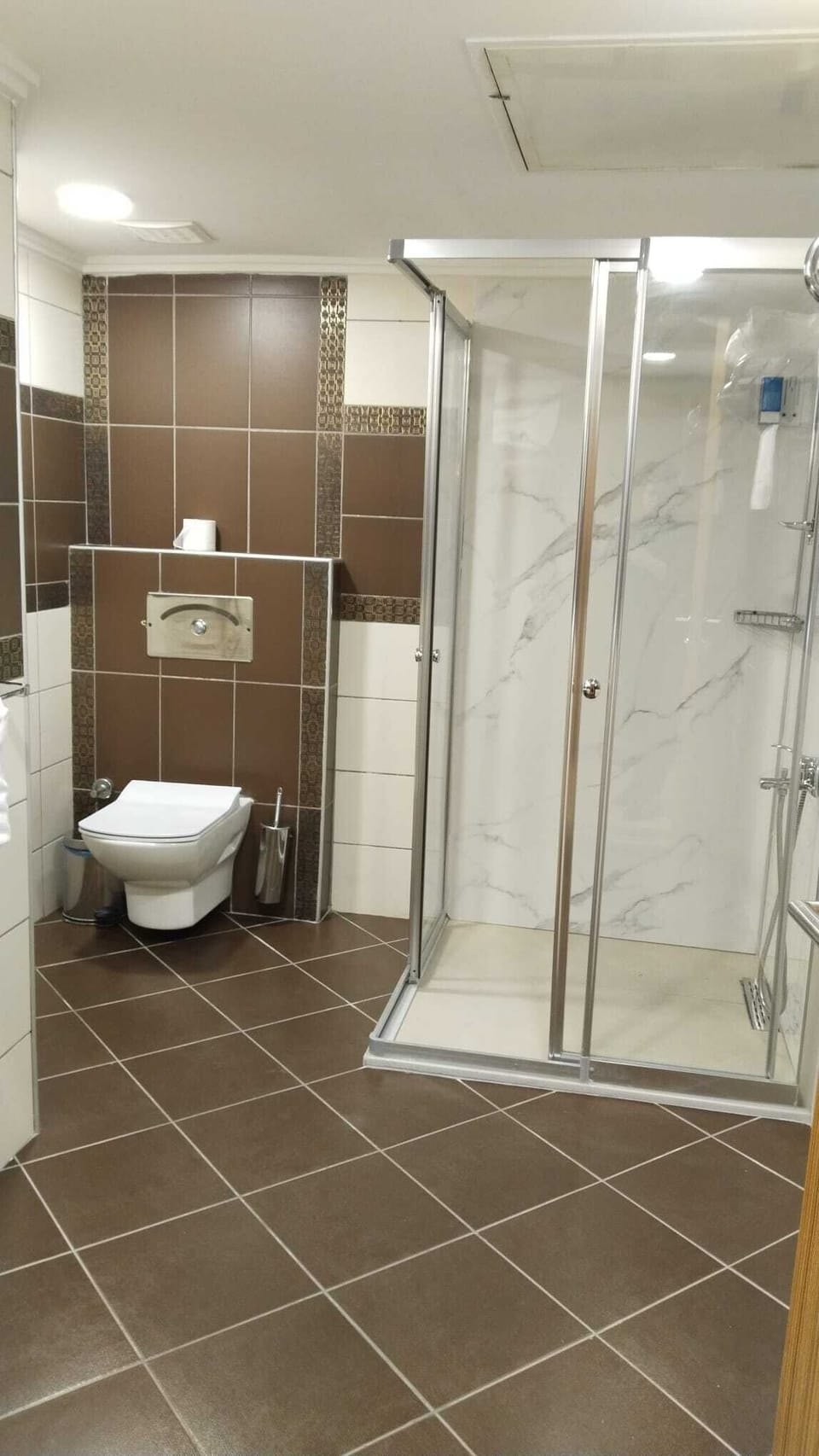 Shower, hair dryer, slippers, towels