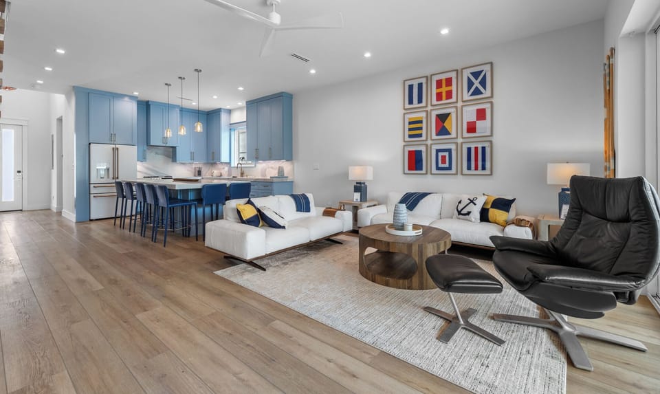 Expansive open living and kitchen area designed for gathering,