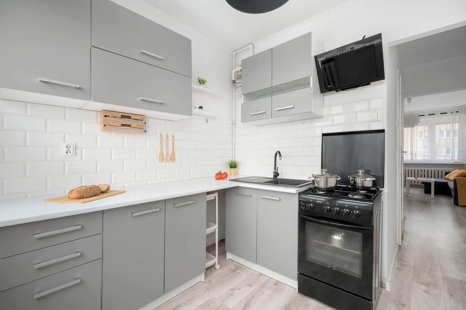 Modern kitchen with gray cabinets and built-in appliances