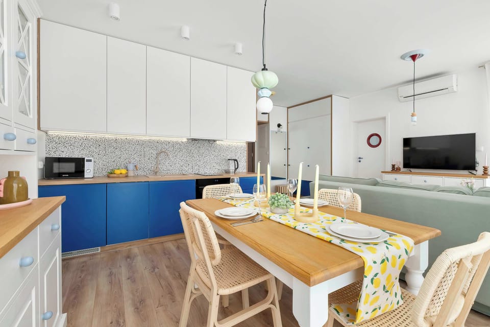 A functional combination of the kitchenette with the living and dining areas.