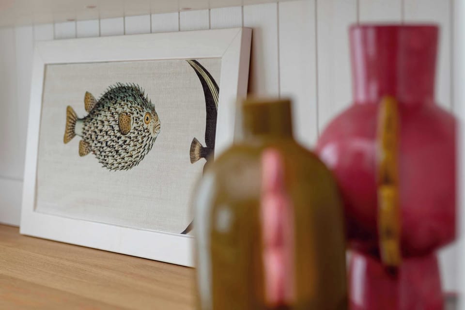 Decorative living room detail with colorful glass bottles