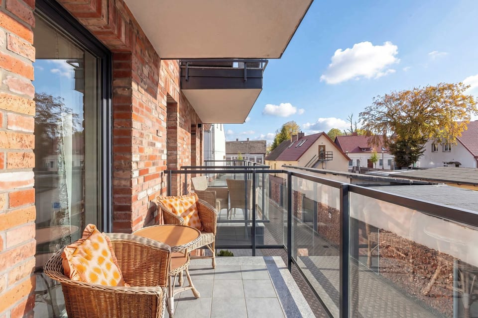 A spacious balcony with views of the surrounding area.
