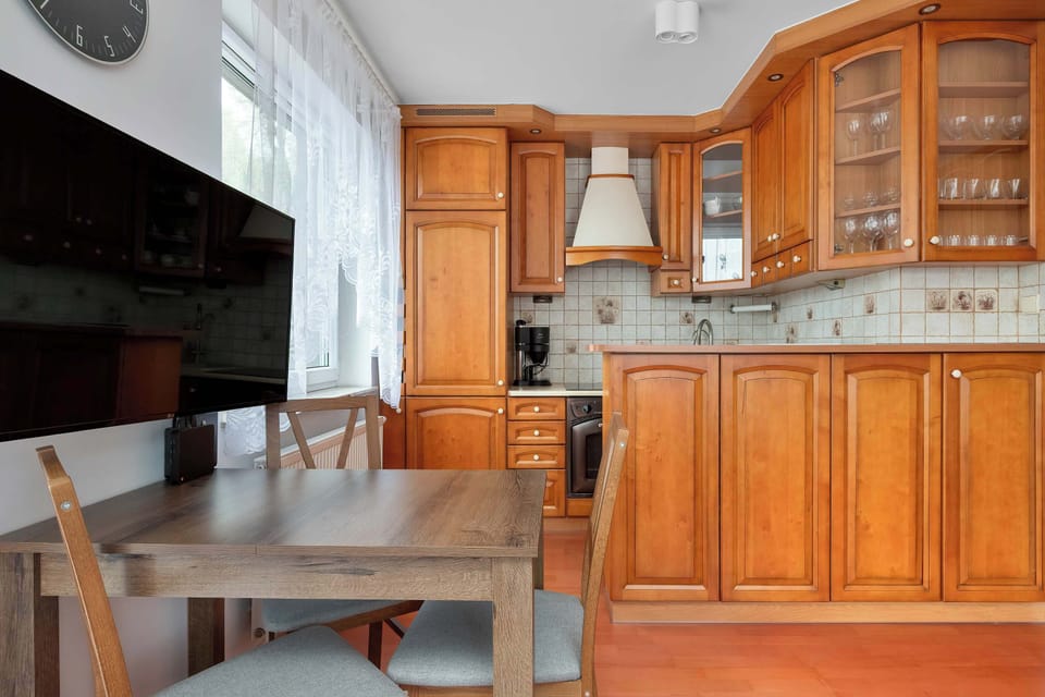 Traditional kitchen with wooden cabinetry and dining area