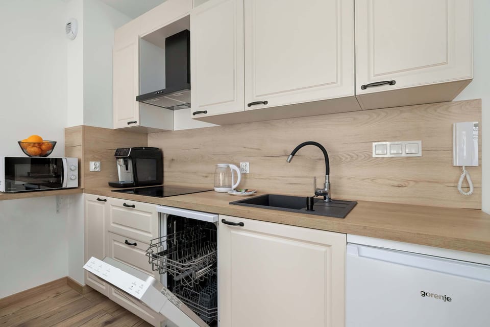 Stylish kitchen with built-in appliances and neutral colors