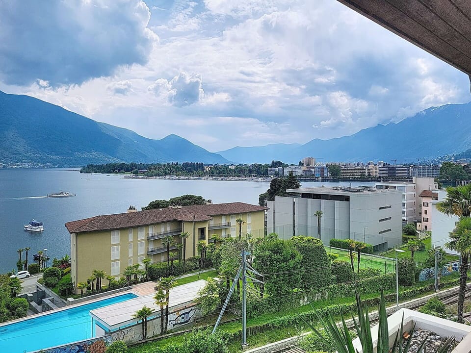Mountainous Landforms, Hill, Residential Area, Coastal And Oceanic Landforms, Mountain Range, Resort, Coast, Swimming Pool, Sea, Apartment