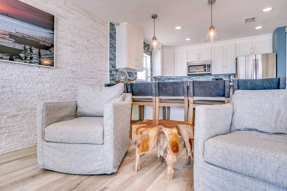 Relax in this beautifully designed open-concept space where coastal charm meets modern comfort. Plush seating, a fully equipped kitchen, and thoughtful touches create your perfect home away from home.