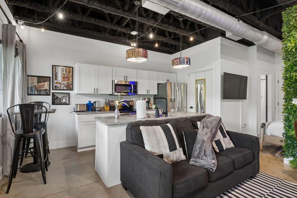 Kitchen: A fully equipped kitchen with full-size appliances — stove, oven, microwave, fridge, and drip coffee to start the day right.