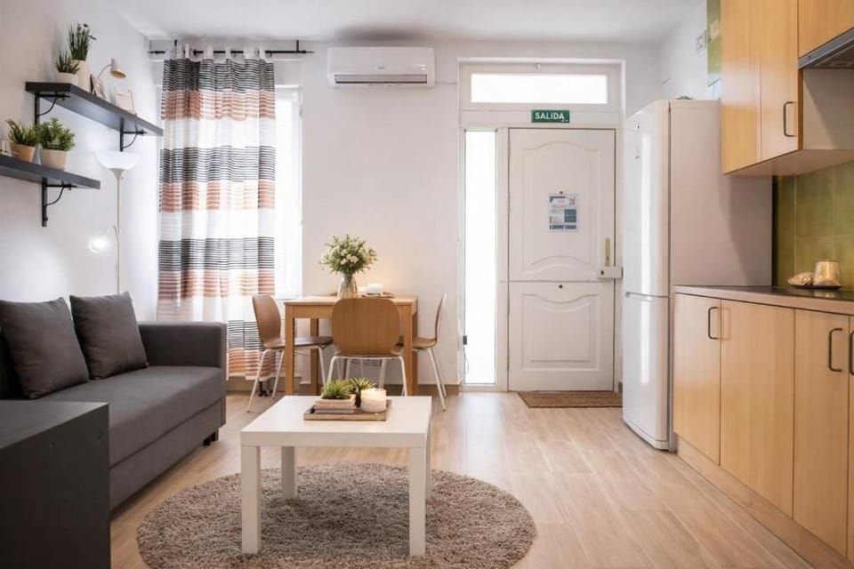Comfort Apartment | Living area | 32-inch flat-screen TV with cable channels