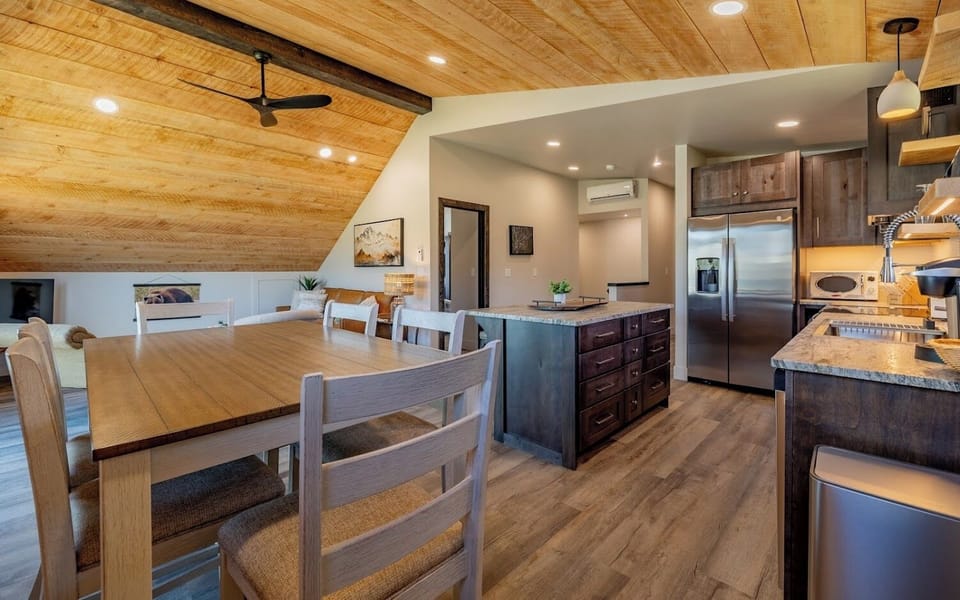 The open living, kitchen and dining area welcome you to gather together