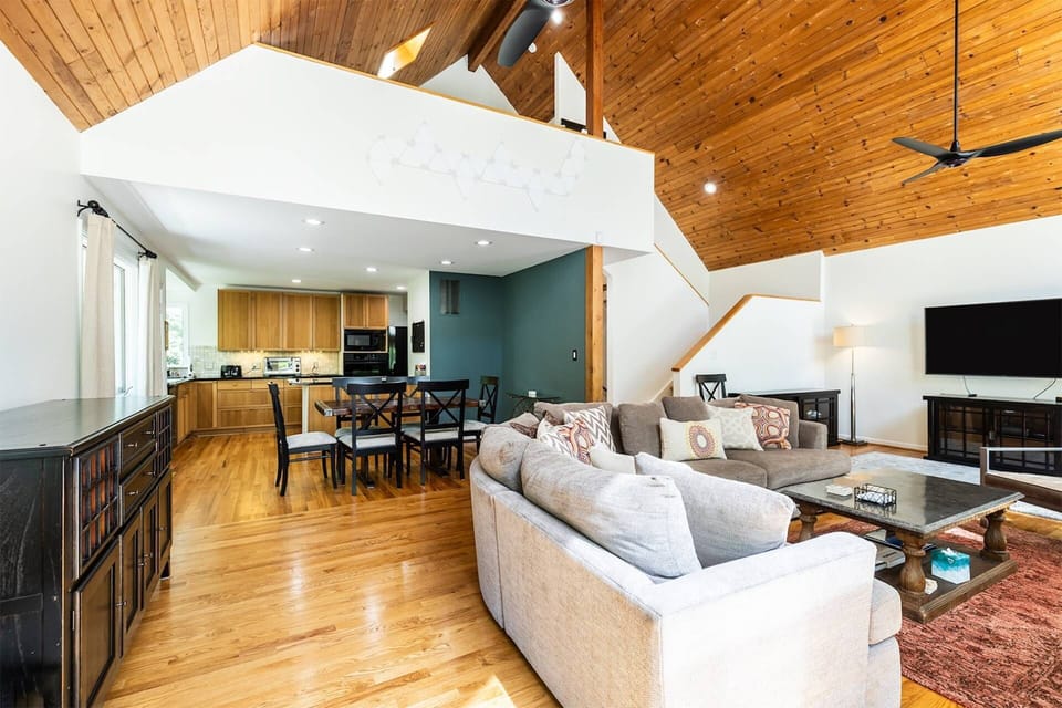Anchoring the home to the kitchen and dining room is the family room, with its own flatscreen TV.