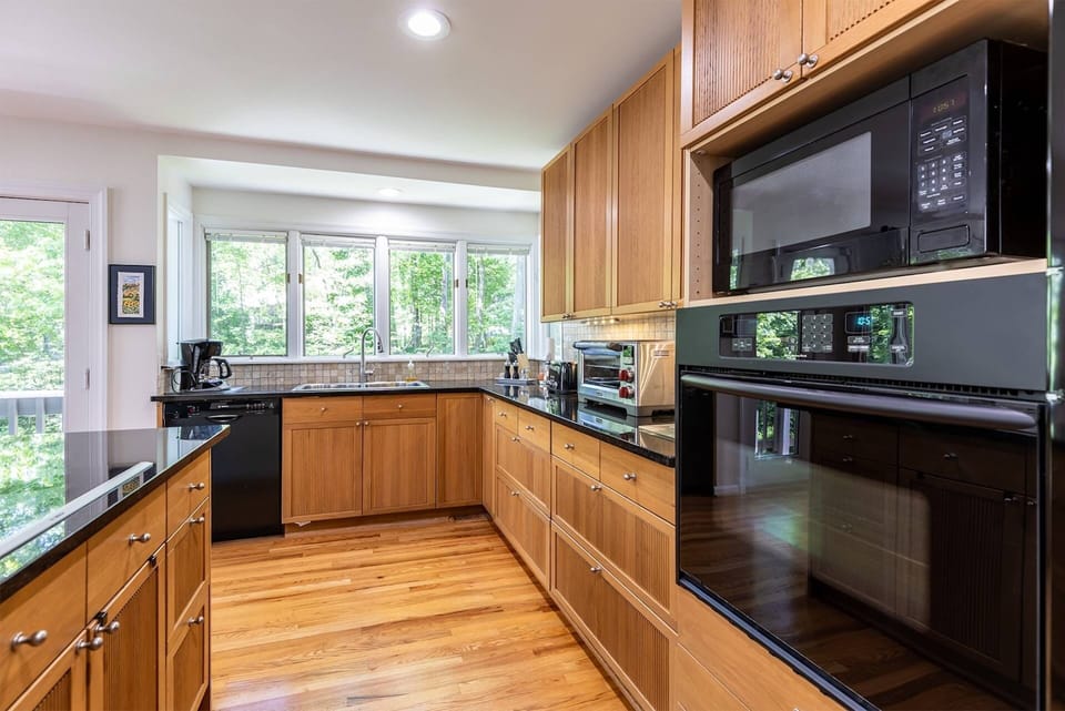 The kitchen is equipped with dining and cookware to serve up to 10 guests.