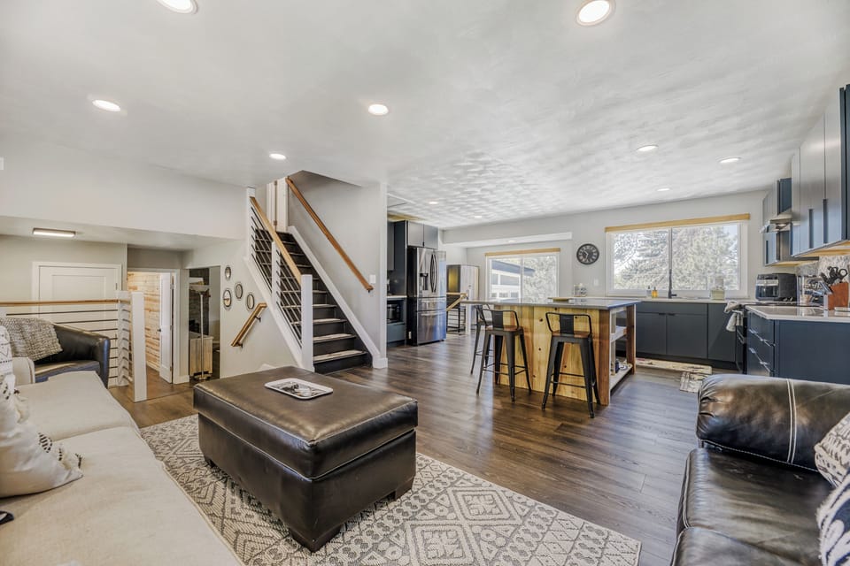 Step into your open-concept retreat where modern style meets mountain comfort. Relax in the spacious living area, gather at the sleek kitchen island, and enjoy seamless flow perfect for making memories with loved ones.