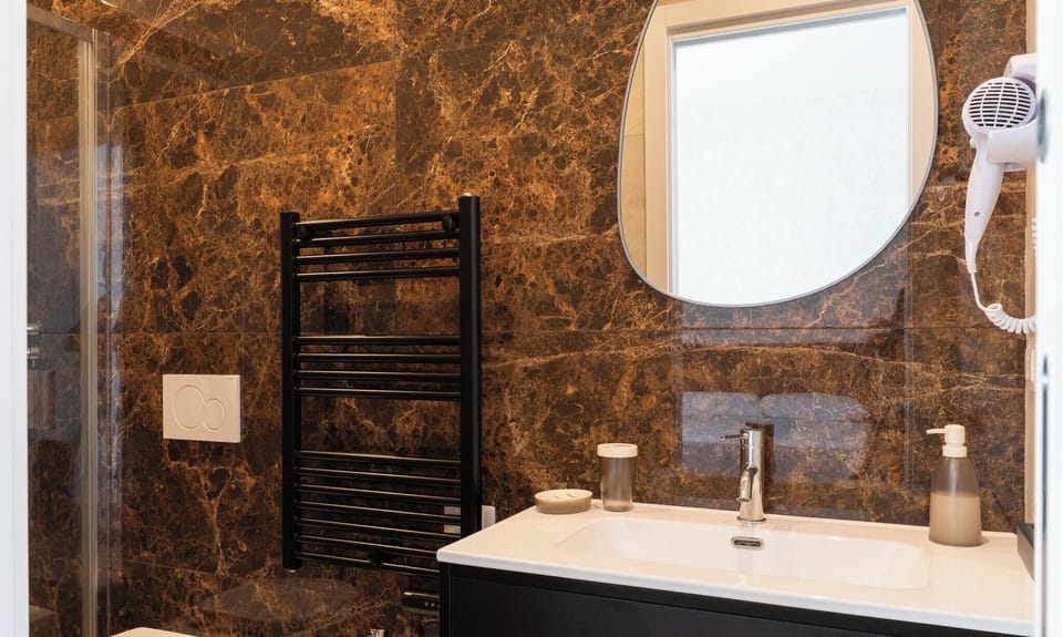 Double Room | Bathroom | Shower, hair dryer, towels, soap