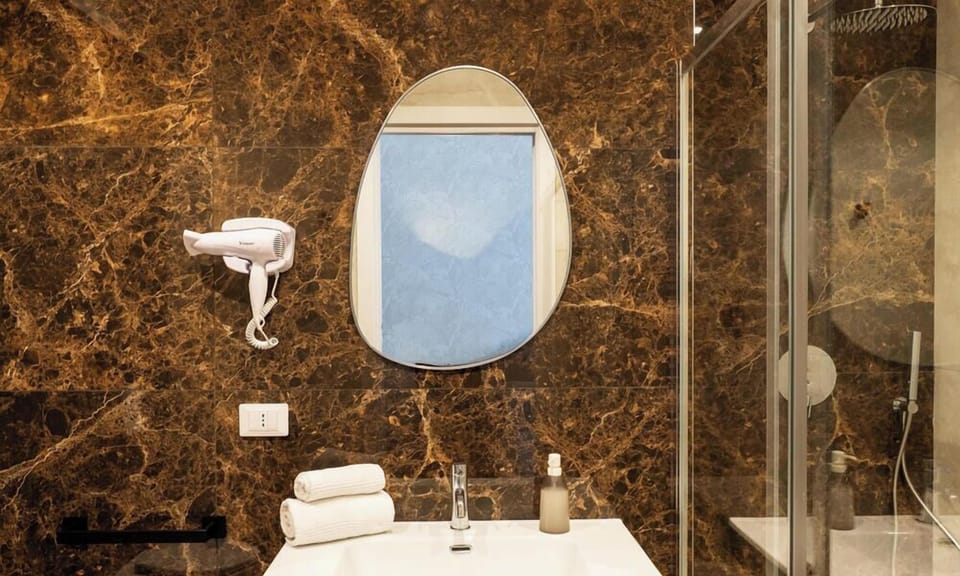 Triple Room | Bathroom | Shower, hair dryer, towels, soap