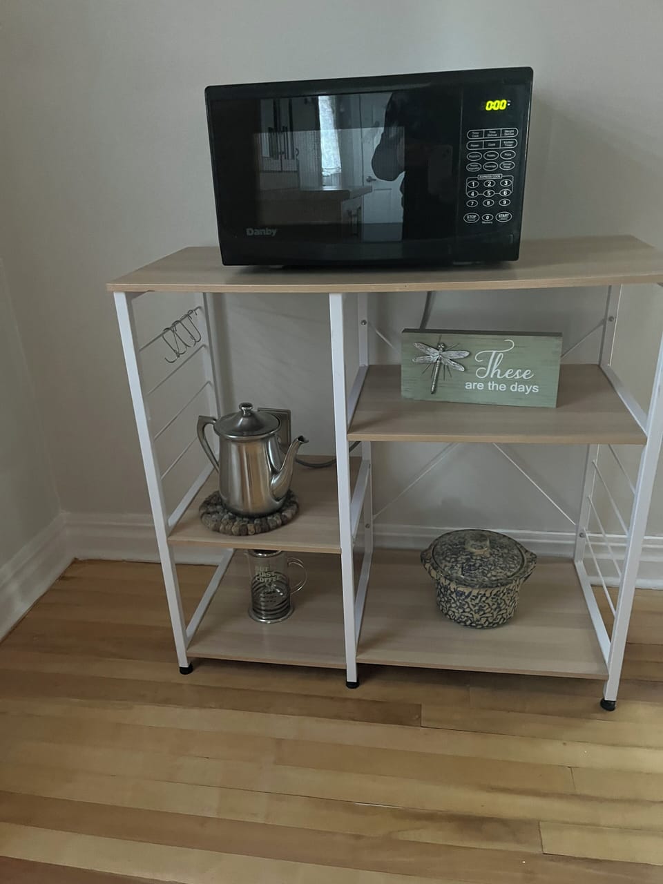 Microwave on stand in kitchen