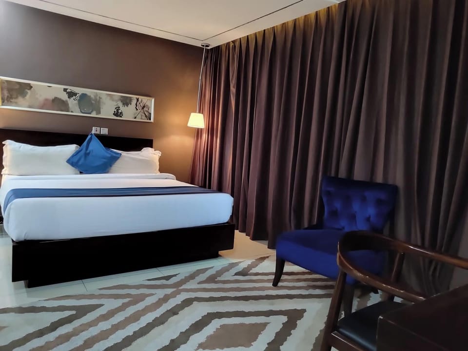 Deluxe Room, Balcony, City View | Desk, laptop workspace, blackout drapes, soundproofing
