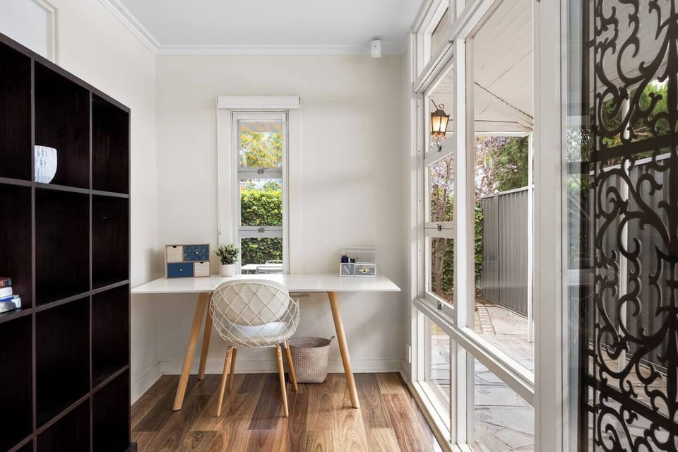 The dedicated workspace offers a calm and light-filled corner for remote work, study, or quiet planning between outings.