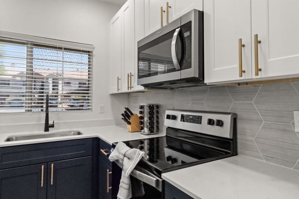 A functional kitchen and dining space perfect for preparing simple meals.