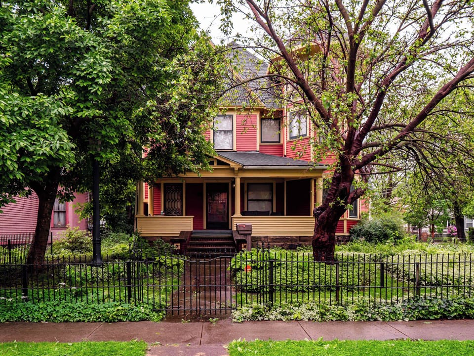 Lush, tree-lined backyard offering a peaceful outdoor escape right at home.
