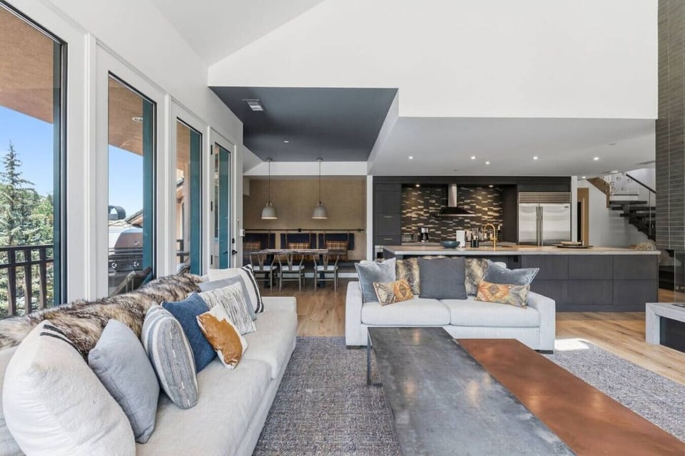 Elegant living room with smart TV, fireplace, and unparalleled views