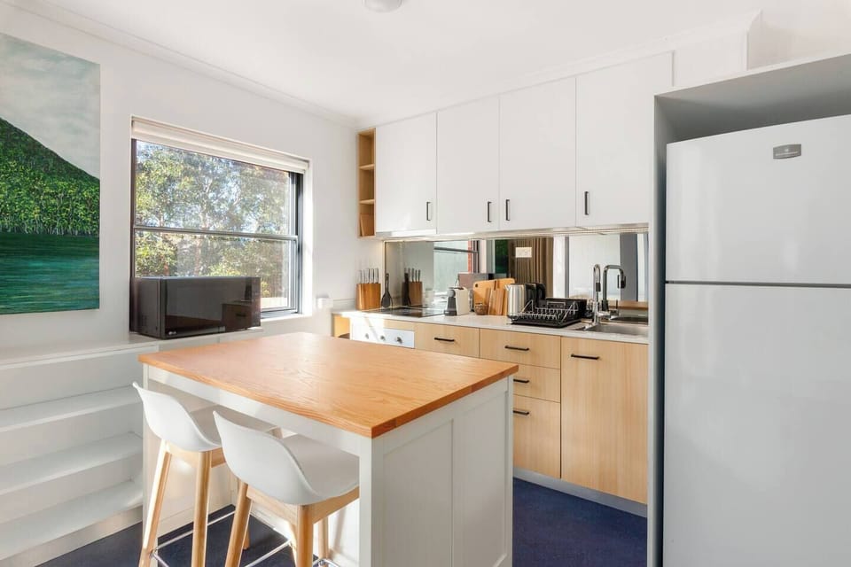 Prepare everything from quick breakfasts to simple dinners in the light-filled kitchen, complete with modern appliances and a practical open-plan layout.