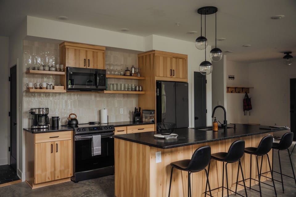 Well stocked kitchen with an island that seats four