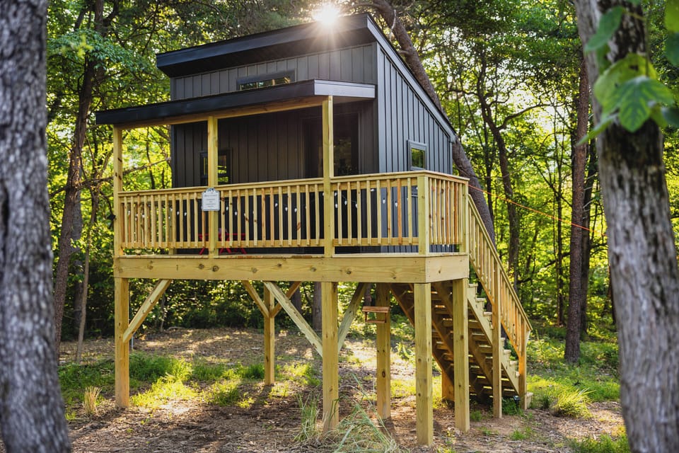 The elevated playhouse is steps from the front porch.