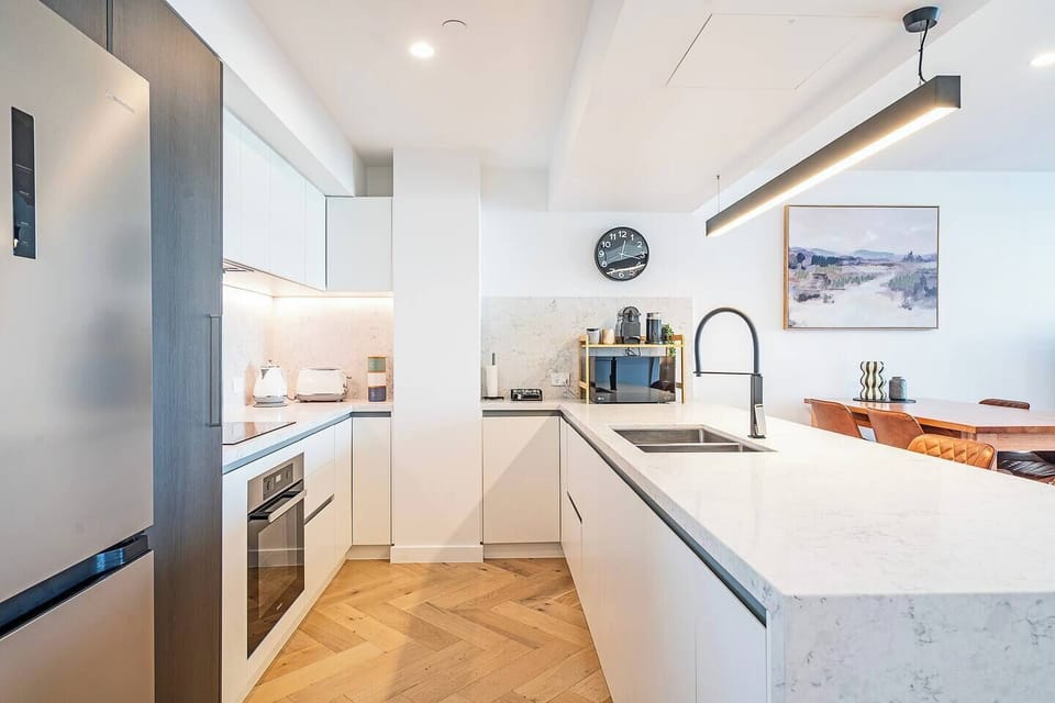Cook with ease in the full kitchen, where integrated appliances, generous bench space, and thoughtful details make longer stays feel effortless.