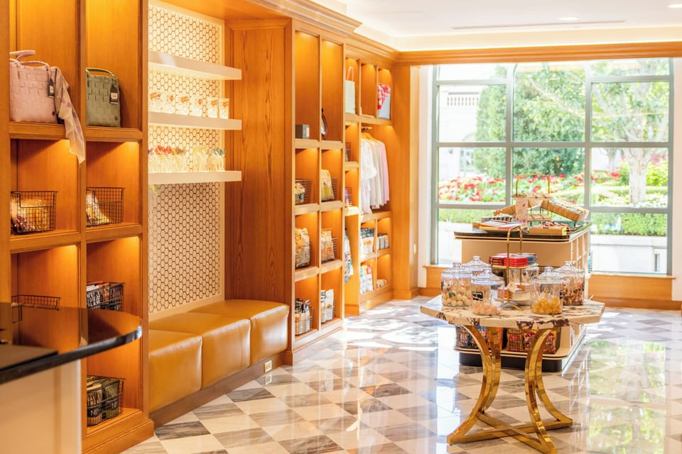 Pick up snacks and souvenirs beside sunlit garden views.
