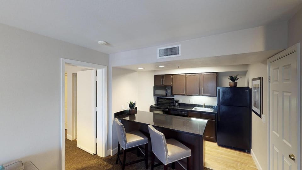 Cook and chat together around the sleek breakfast bar.