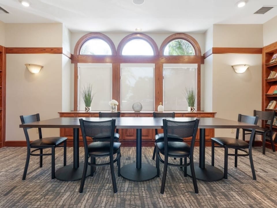 Work or chat comfortably by arched windows and soft light.