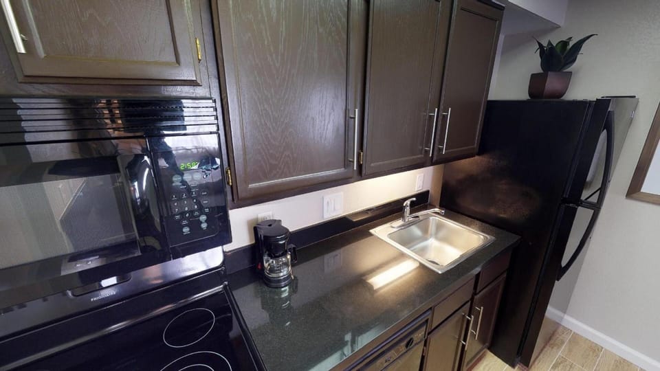 Cook simple meals with a full kitchen and ample storage.