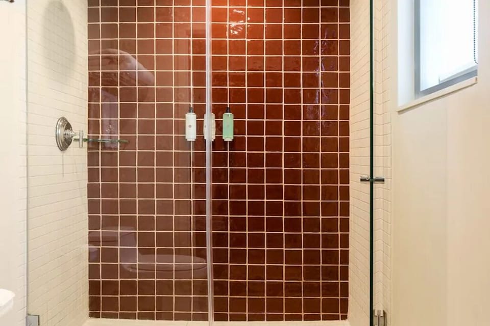 Refresh in a clean, modern shower with bright light.