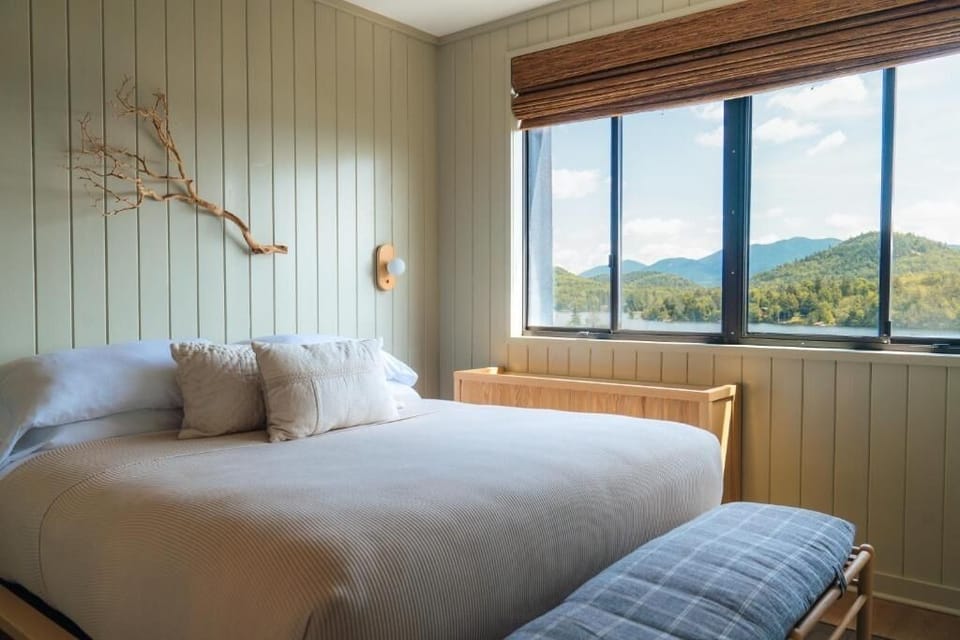 Wake up to mountain views from this serene king bed.