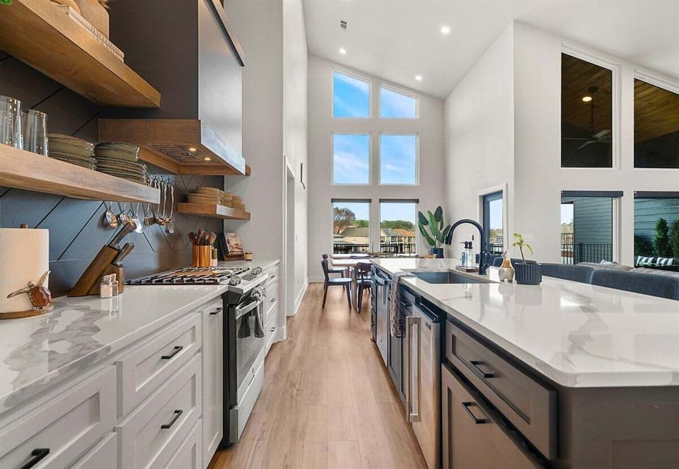 Here's another look at the kitchen's expansive island and modern cabinetry, offering plenty of seating for morning coffee or evening cocktails.