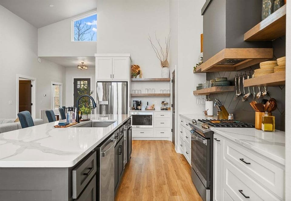With ample cabinetry and modern finishes, this kitchen blends clean design with practical storage and workspace.