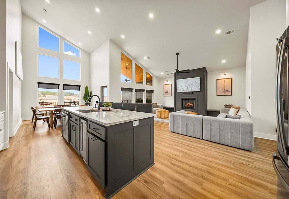 The bright and airy kitchen features high-end appliances, generous counter space, and an open design that keeps everyone connected.
