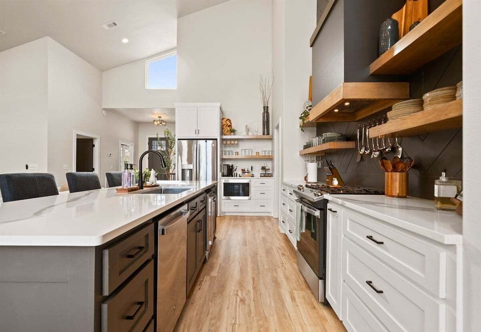 With ample cabinetry and modern finishes, this kitchen blends clean design with practical storage and workspace.