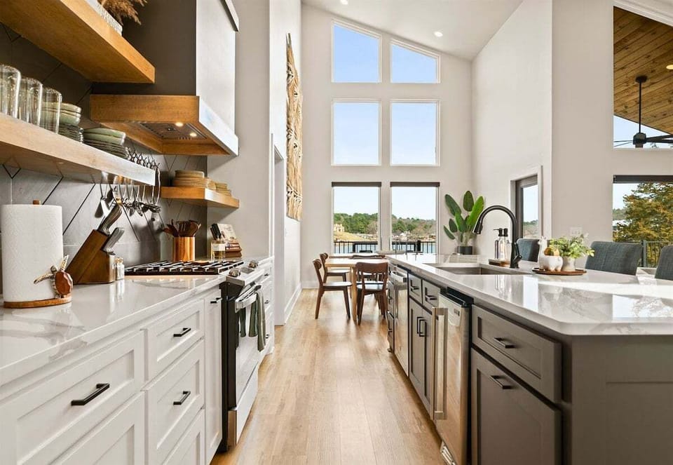 Here's another look at the kitchen's expansive island and modern cabinetry, offering plenty of seating for morning coffee or evening cocktails.