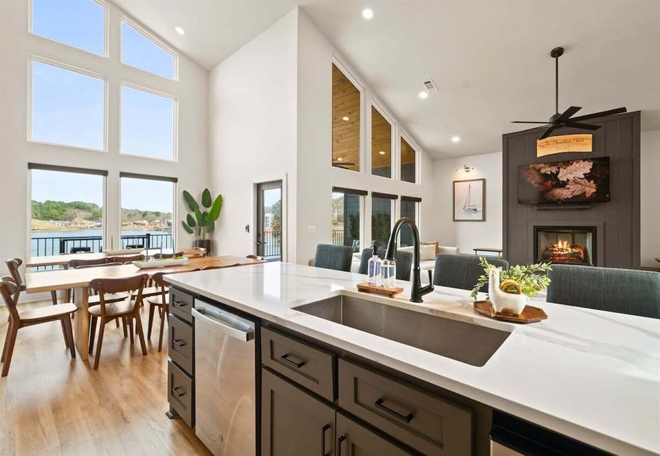 The bright and airy kitchen features high-end appliances, generous counter space, and an open design that keeps everyone connected.