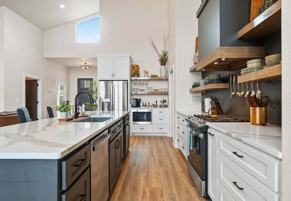 With ample cabinetry and modern finishes, this kitchen blends clean design with practical storage and workspace.