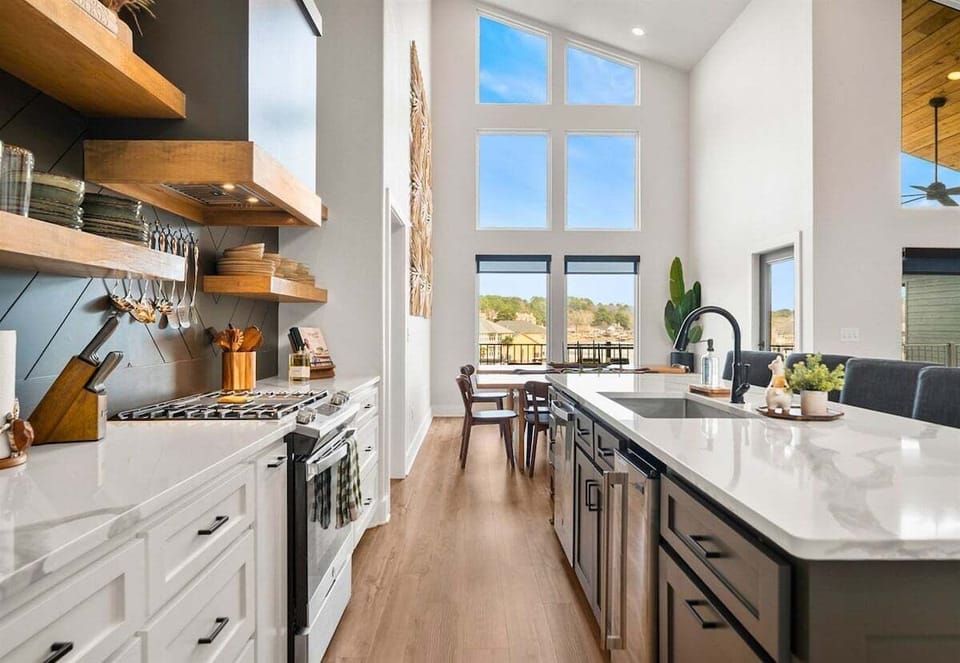 Here's another look at the kitchen's expansive island and modern cabinetry, offering plenty of seating for morning coffee or evening cocktails.