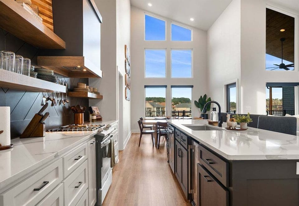 Here's another look at the kitchen's expansive island and modern cabinetry, offering plenty of seating for morning coffee or evening cocktails.