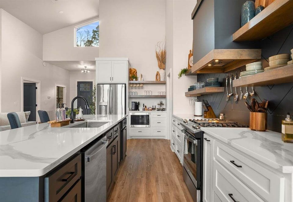 With ample cabinetry and modern finishes, this kitchen blends clean design with practical storage and workspace.