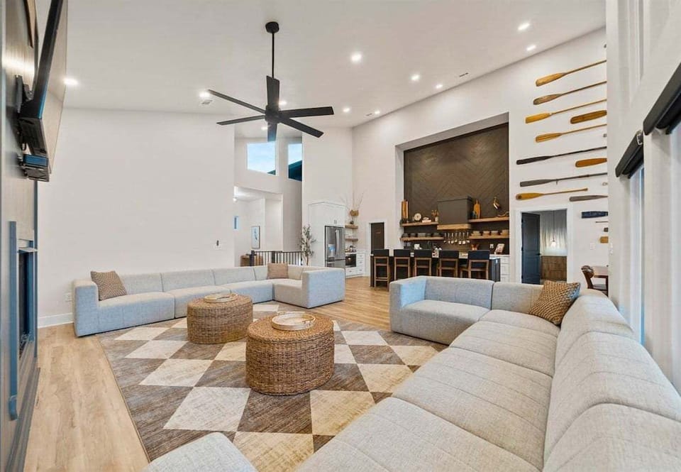 The living room offers a stylish yet comfortable place to unwind, with plush sofas, natural light pouring in, and thoughtful touches that make it feel instantly like home.