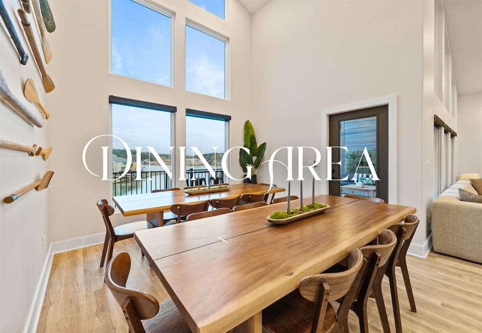 The dining area offers a welcoming space to gather around the table, with plenty of seating and natural light that makes every meal feel special.