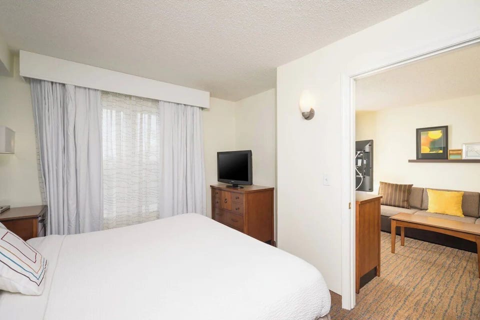 Drift off comfortably in a quiet bedroom with soft linens.