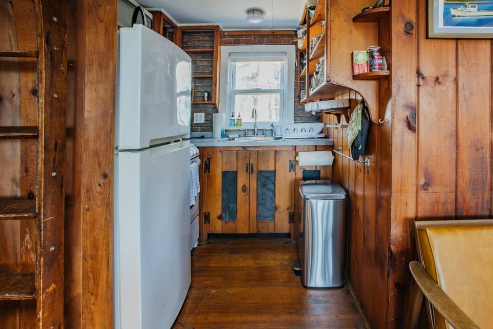 Small kitchen with all appliances and kitchenware for your meals