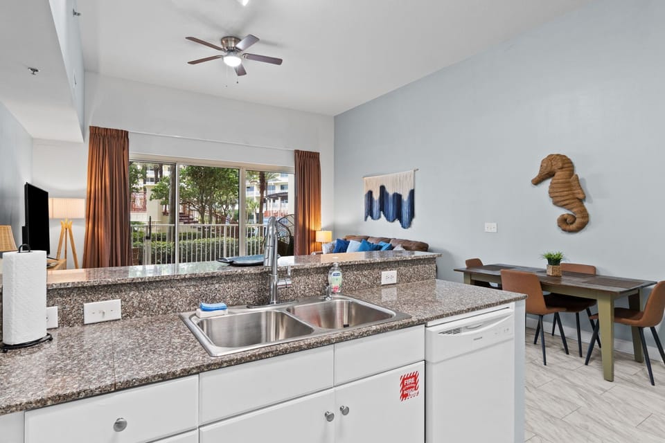Kitchen with bar seating, overlooking the Living Room and Dining Area.